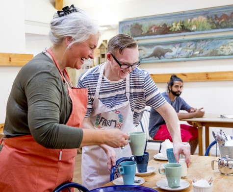 volunteer working in a busy cafe